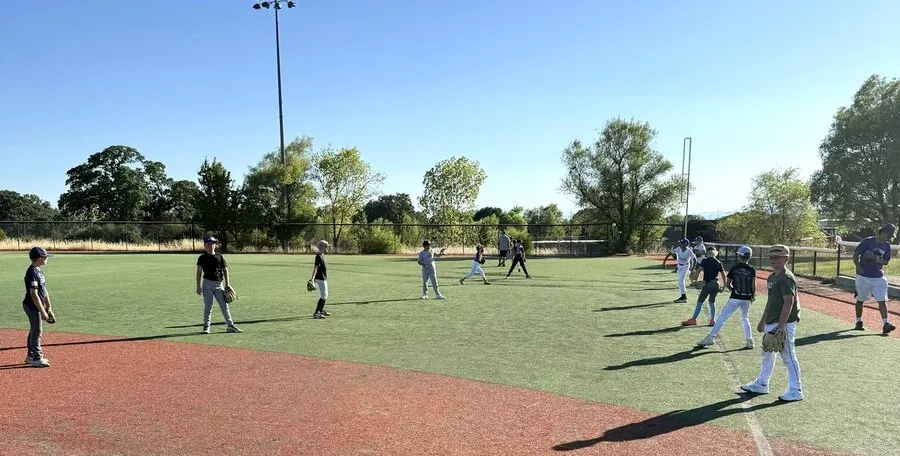 Summit Baseball players warming up at their first practice at Redding Sports Park.